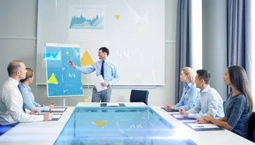 businessman presenting statistics to a group of individuals in a meeting room