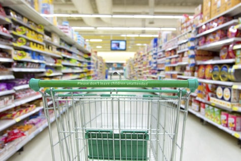 shopping trolley in supermarket aisle