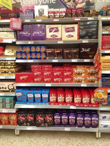 instore shelves filled with chocolate confectionary