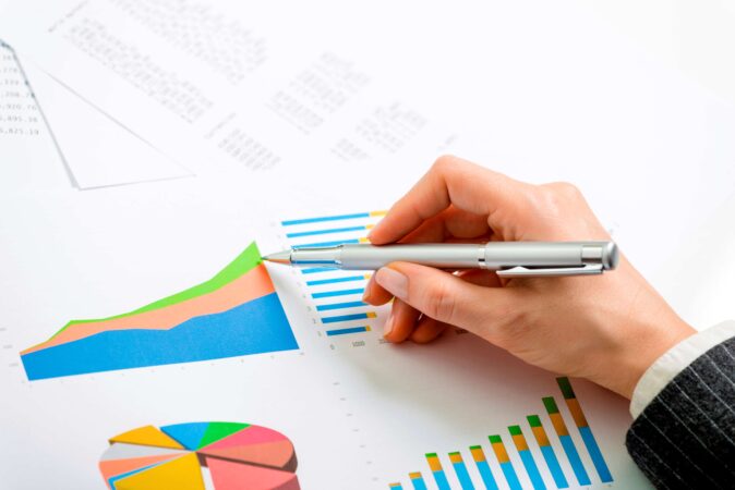 Businessman alaysisng statistical graphs and charts